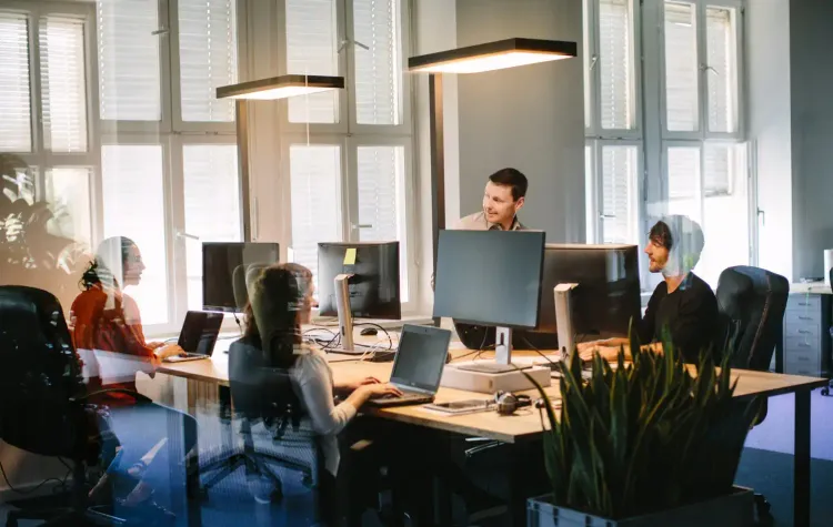 Exelcom IT team managing business systems in a modern Australian office